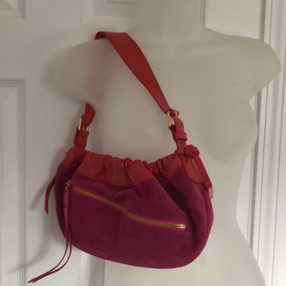 Eye-catching Francesco Biasia’s vibrant patent/suede slouchy shoulder bags